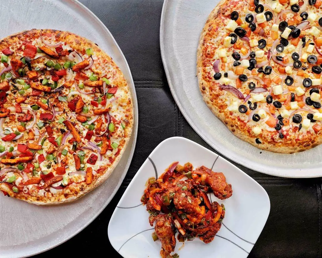 Pepperoni and meat lovers pizza varieties on display at PizzaNapoli Lloydminster
